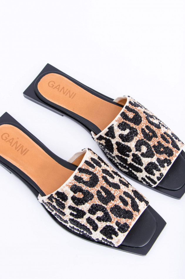 Ganni Slipper im Animal Print in Schwarz/Beige gemustert